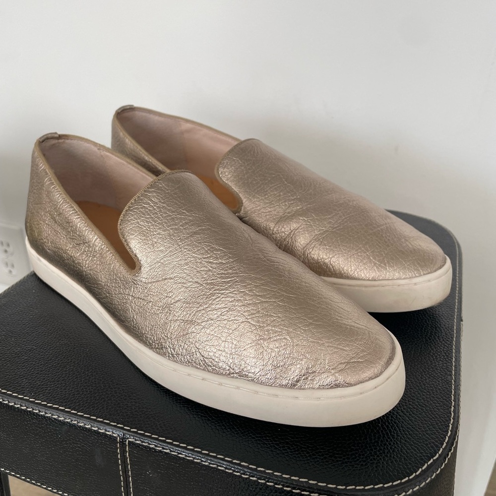 Gold slip on Birdies sneakers